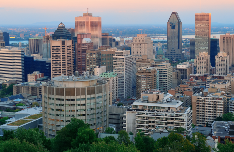 montreal city skyline at sunset viewed from mont royal with urban skyscrapers