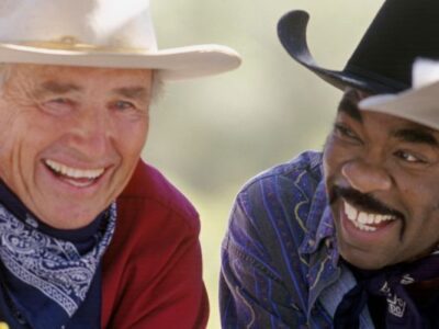 Cowboys laughing in a group